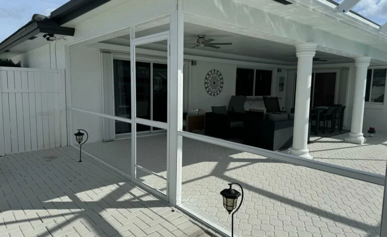 Patio sliding glass door repair and restoration with screened enclosure.