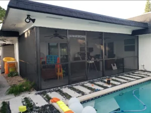 Enclosed patio with sliding screen door repair and window screen replacement, affordable screen repair services for long-lasting home protection.