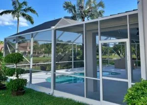 Pool screen enclosure with sliding screen door repair and window screen replacement, professional screen services for durable and affordable maintenance.